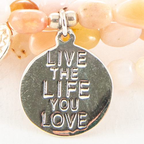 This cute Live The Life You Love Charm is set in a 925 sterling silver disc and is the perfect addition to any bracelet.