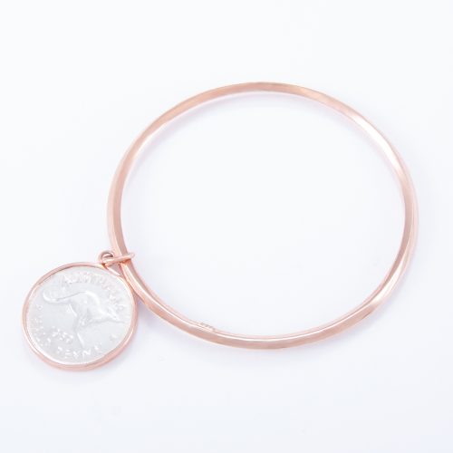 Our Rose Gold Half Penny Bangle. Shown here, with a beveled edge and plated over hand-made 925 sterling. As well as, with a unique 2-tone coin. It’s a truly stunning and timeless piece. In short, the perfect gift idea for someone extra special. Or as a self-indulgent addition to any jewellery collection.