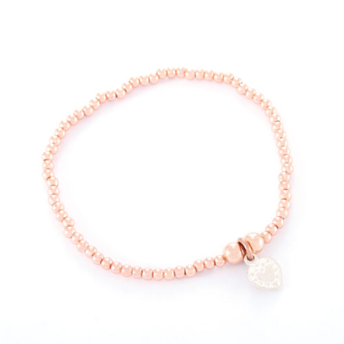 Our Rose Gold Ball Bracelet. Shown here, with a hand-made 925 sterling silver love heart. A truly beautiful piece. In short, it's the perfect gift for someone extra special. Or as the ideal self-indulgent purchase to add to any personal jewelry collection.