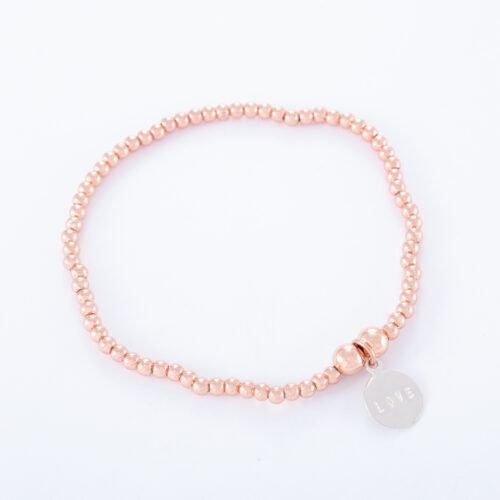 Our Rose Gold Ball Bracelet. Shown here, with a hand-made 925 sterling silver love disc. There's lots of love in this elegant piece. In short, it's an ideal self-indulgent purchase to add to your own personal jewelry collection. Or as the perfect gift for somebody very special.