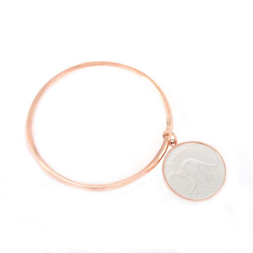 Our Rose Gold Penny Bangle. Shown here, with a bevilled edge, plated over hand-made 925 sterling silver. As well as, with a beautifully finished 2-tone coin. It's a truly stunning and unique piece. In short, the ideal gift for someone special. Or as a self-indulgent addition to any personal jewelry collection.