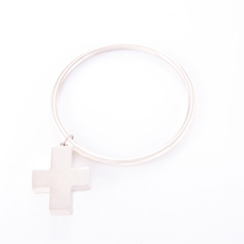Our Sterling Silver Cross Bangle. Shown here, beautifully handcrafted in 925 sterling. As well as, with a sterling cross. A truly unique piece. In short, it makes for a stunning gift idea. Or as a self-indulgent purchase to add any personal jewelry collection.