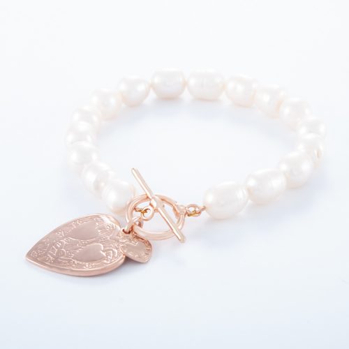 Our Freshwater Pearl Rose Gold Double Heart Bracelet. Shown here, with a beautiful charm with pink gold plated over 925 sterling silver. Also with a small flat heart in rose over sterling. In short, this stunning piece has twice the love. It’s the ideal self-indulgent addition to any personal jewellery collection. Or as the perfect gift for somebody extra special.