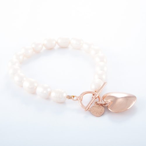 Our Freshwater Pearl Rose Gold Small Puffed Heart Bracelet. Shown here, with a beautiful pink gold charm plated over 925 sterling silver. Also with a small flat rose over sterling heart. In short, this amazing piece has double the love. It’s the perfect self-indulgent addition to any jewellery collection. Or as the ideal gift for that extra special person.