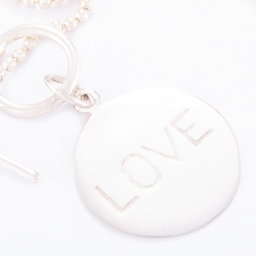 This Love Disc charm is the perfect thank you gift idea for your girlfriend.