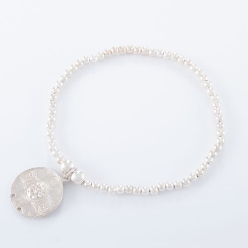 Our Sterling Silver Flower Disc Ball Bracelet. Shown here, finished in 925 sterling with a stunning charm . In short, this amazing fun feminine piece. Also the ideal gift idea for that extra special someone. Or as the perfect self indulgent purchase to add to any personal jewellery collection.