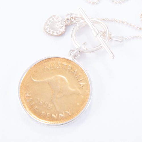 Our Fine Sterling Silver Fob Necklace and Gold Half Penny. Shown here, a beautiful hand-made coin with gold over 925 sterling. Also, accompanied by a small flat sterling heart. In short, this stunning piece is timeless, full of