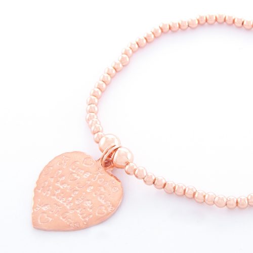 Our Rose Gold Small Tiamo Heart Ball Bracelet. Shown here, beautifully engraved and handcrafted in pink gold over 925 sterling. There’s twice the love in this elegant, stunning piece. In short, it’s the perfect self-indulgent purchase to add to your own personal jewelry collection. Or as a unique gift idea for that someone very special.