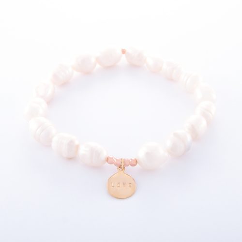 Our Freshwater Pearl Bracelet with Rose Gold Love Disc. Shown here with beautifully engraved pink gold plating over 925 sterling. In short, this stunning piece is elegant and full of love. It’s the ideal gift for someone extra special. Or, as the perfect self-indulgent purchase to add to your own jewelry collection.