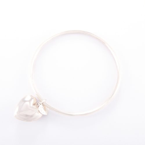 Our Sterling Silver Bangle and Puffed Heart. Shown here, hand-made in a 925 sterling bevel-edged band, with a large puffed heart. As well as, with a small heart in sterling. In short, it's a truly stunning and unique piece. Which makes for the ideal gift idea, with lots of love. Or as a self-indulgent purchase to add to any accessories collection.