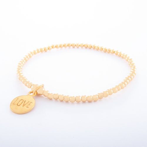 Our Gold Ball Chain Bracelet and Love Disc. Shown here, beautifully handcrafted in gold plated over 925 sterling. As well as with a stamped LOVE disc. A relaxed piece that's full of fun. In short, it’s the perfect gift for someone special. Or as a self-indulgent purchase to add to your own jewelry collection.