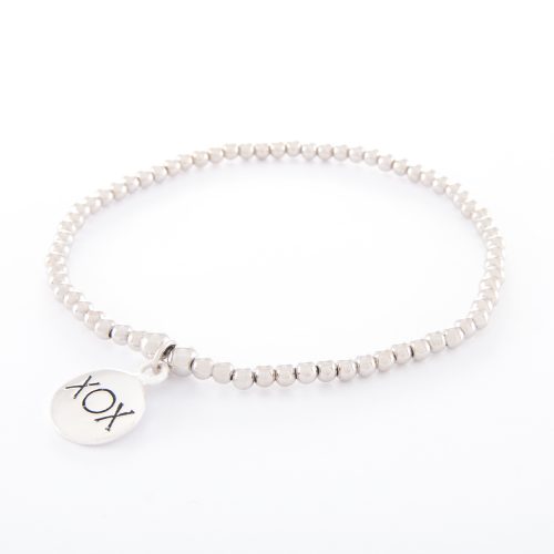 Our Sterling Silver Ball Bracelet with Kiss Hug Kiss Disc. Shown here, handcrafted with a stunning stamped XOX, 925 sterling Charm. In short, this beautiful piece is full of elegance, love, and kisses. It’s the perfect self-indulgent purchase to add to your own jewelry collection. Or as the ultimate gift idea for someone very special.