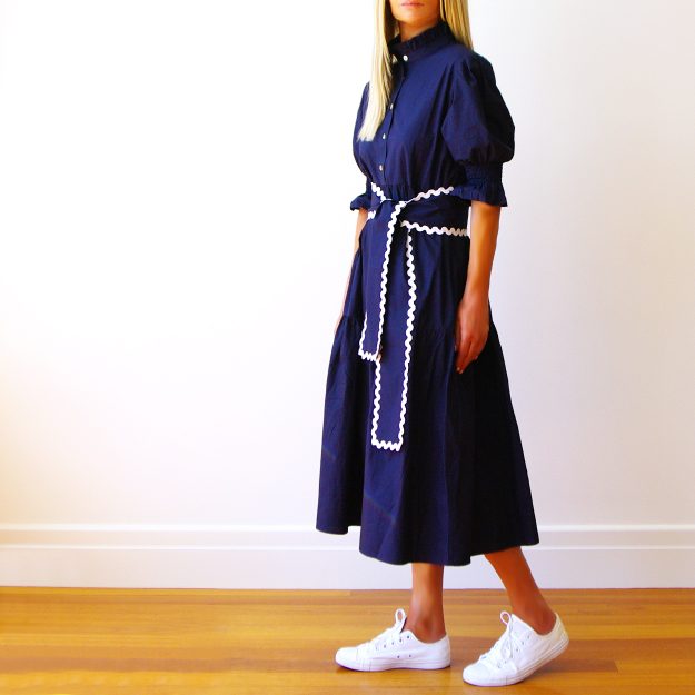 Lottie Navy Cotton Poplin Dress with Ric Rac Belt.